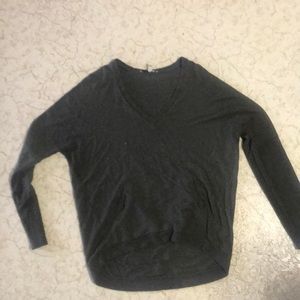 Green sweater with pockets.